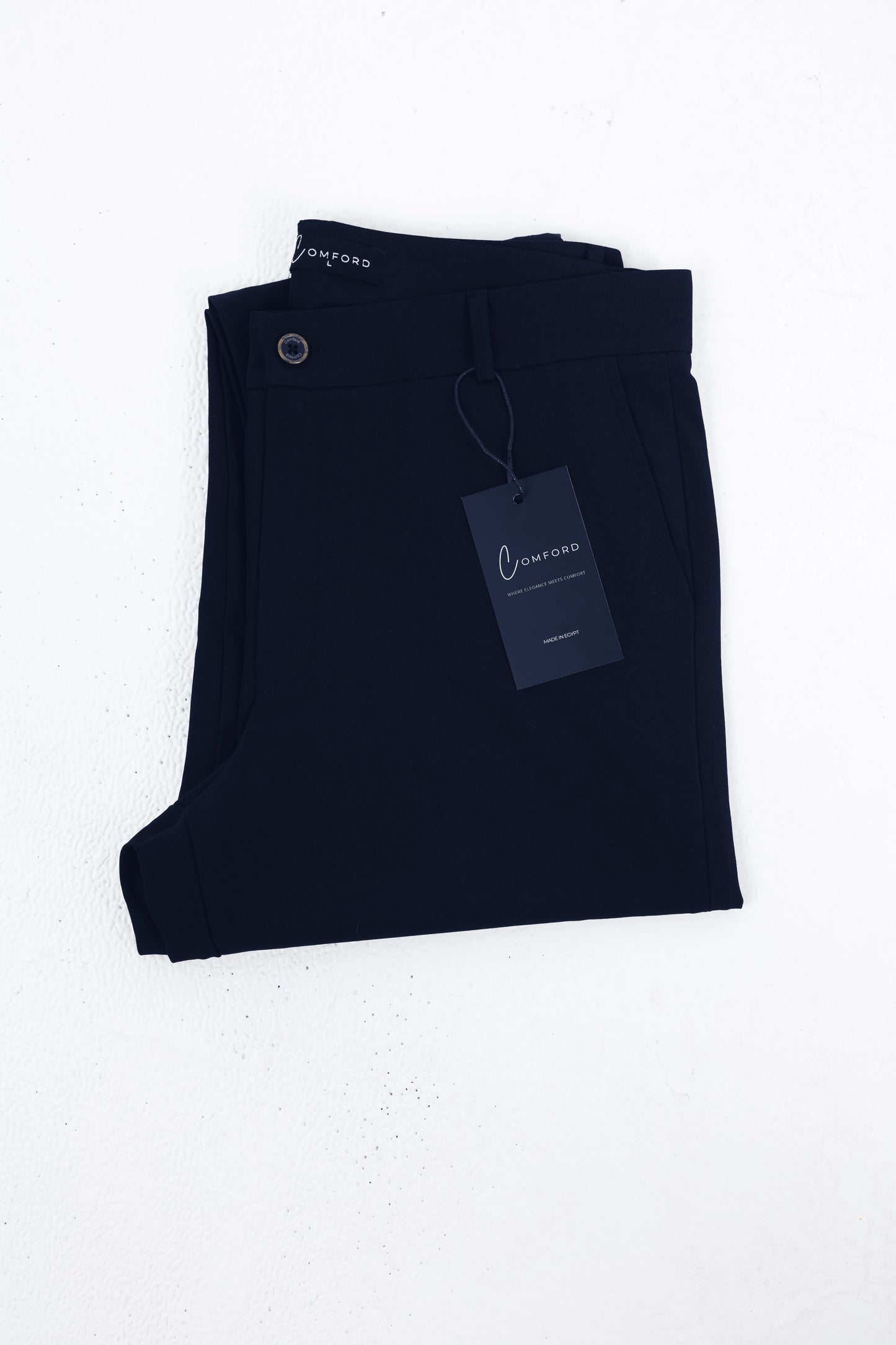 Comford Classic Navy Blue pants - folded product shot with brand tag