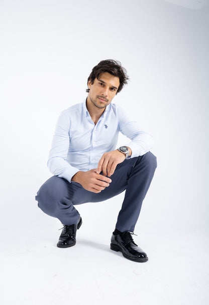 Comford Classic Slate Blue trousers - full-length view of sleek, professional design, model doing squat, showing pants flexibility 