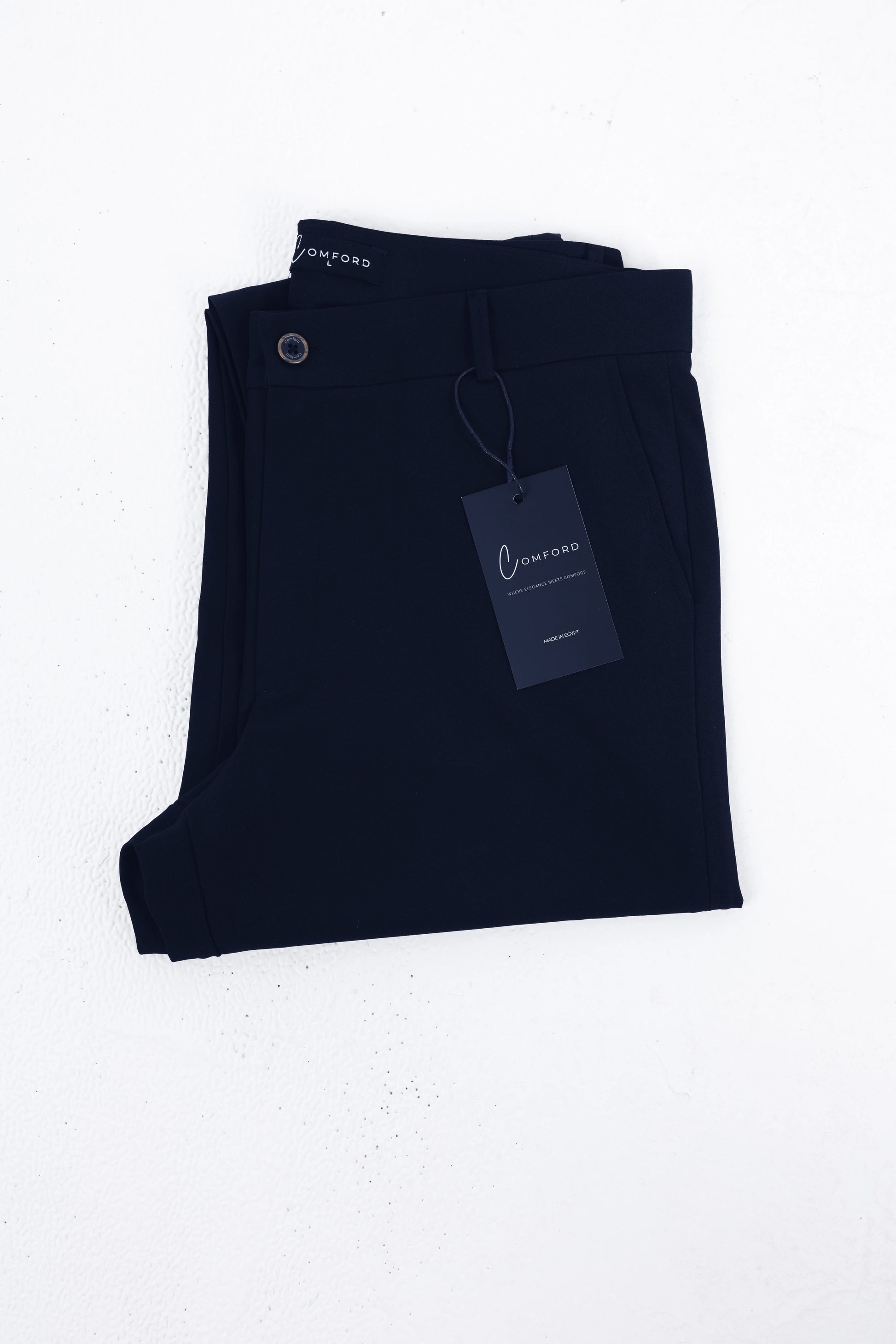 Comford Classic Navy Blue pants - folded product shot with brand tag